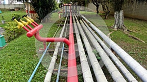 FIRE AND INDUSTRIAL PRODUCTS PIPES PASSING BETWEEN THE GARDENS photo