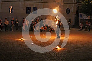 Fire juggler performs