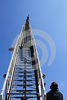 Fire ladder with fireman ontop