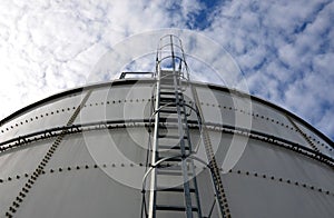 The fire ladder leading to the roof of the hall is secured by a grille in the lower part of the protective grille. white metal war