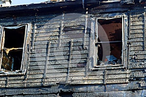 Fire line in front of a destroyed home. burnt house after fire