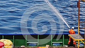 Fire man doing testing of fire pump and hydrant onboard a marine vessel