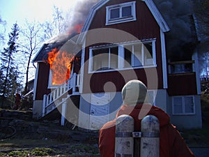 Fire men in action, house burning