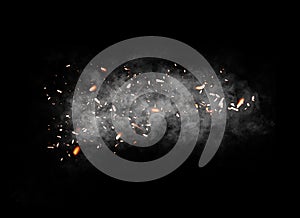 Fire particle . Embers debris on black background. Smoke on background texture. photo