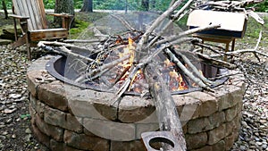 Fire pit with burning wood and crackling fire sounds