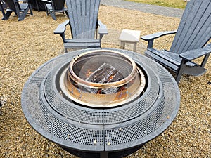 Fire pit with chairs in park