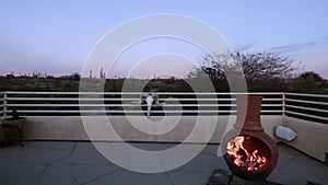 Fire Place On Deck Of Residential Home A Sunset In Arizona