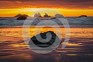 Fire red sunset over sea stacks at Oregon Coast.