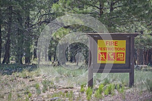 Fire Restrictions Sign in the Arizona Pine Forest. Flagstaff, Arizona