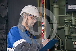 Fire safety engineer checks fire extinguishing system at hazardous production facility