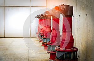 Fire safety pump on cement floor of concrete building. Deluge system of firefighting system. Plumbing fire protection. Red fire