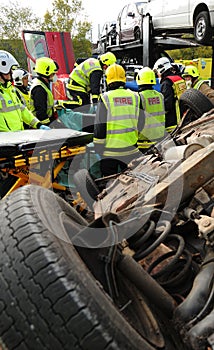 Fire service and ambulance crews at a car crash