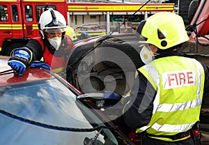 Fire service jaws of life cutting at a car crash