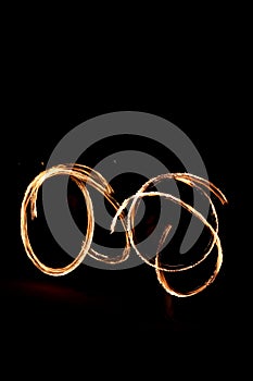Fire show on the beach at night.drak backgrounds