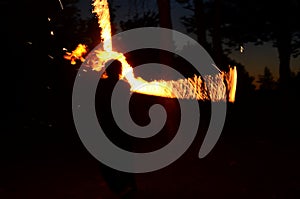 fire show, dancing with flame, male master fakir with fire works, performance outdoors