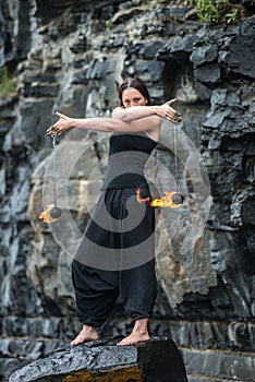 Fire show girl with flaming torches