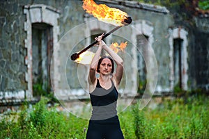 Fire show girl with flaming torches