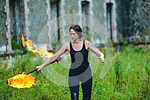 Fire show girl with flaming torches