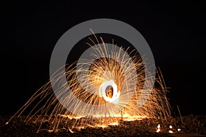 Fire show at night on the beach