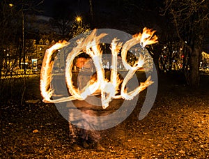 Fire sign registering the word love during night photo