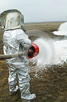 Fire in a silver protective suit.