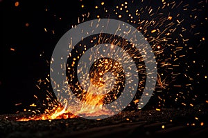 Fire sparks flying on black background