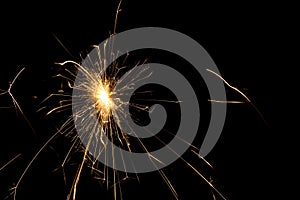 fire sparks particles on black background for overlay design, shot taken with slow shutter, long traces, large sheaf of