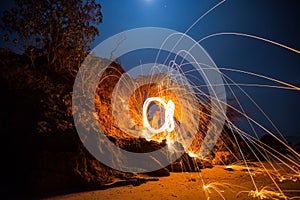 Fire spinning from steel wool