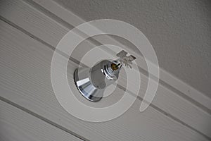 Fire sprinkler placed on wall closeup.Fire fighting equipment, sprinkler on grey wall background.Automatic head fire sprinkler