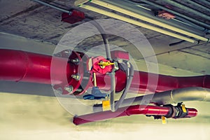 Fire sprinkler and red pipe ( Filtered image processed vintage