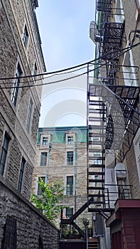 Fire stairs in the back of stone house buildings in the old town of Quebec City, Canada