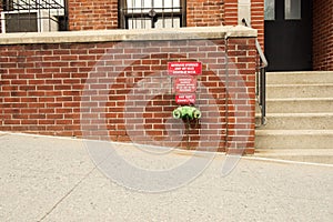 Fire standpipe on a brick wall