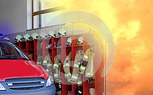 Fire station building with red fire truck and firefighters uniform, fire flame, voluntary fire brigade in Austria, volunteering