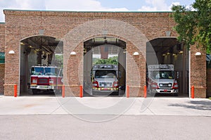 Fire station firehouse with paramedics & fire trucks