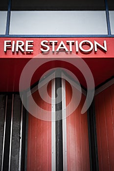 Fire station sign against bright red background