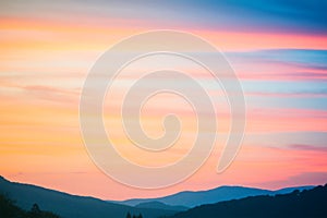 Fire Sunset at mountains. Sky and clouds texture