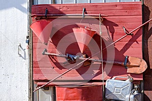 Fire tackles and equipment hanging on firefighters security place on a wall