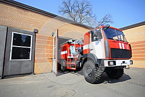 Fire truck driving out of the garage for firefighting, firehouse