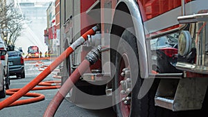 Fire Truck at a fire withfire fighters background