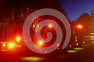 Fire truck with flashing lights, lighting in dusk