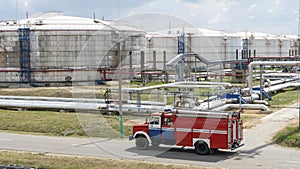 Fire truck in industrial plant. A large red fire rescue vehicle in the chemistry refinary plant. Fire safety concept