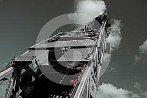 Fire Truck Ladder into Steel Gray Sky