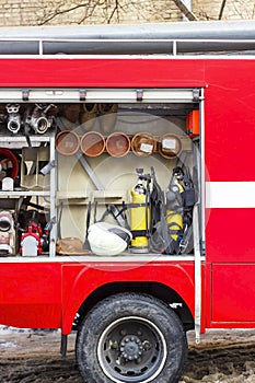 The fire truck is red. Fire and rescue equipment in a fire truck