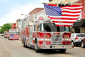 Fire Trucks with American Flags at Small Town Parade