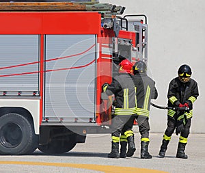 Fire trucks and firefighters with uniforms