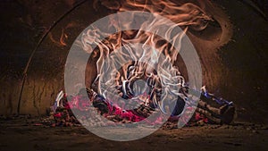 Fire wood burning inside an oven