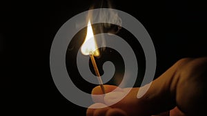 Fire of a Wooden Match in Complete Darkness, Disappears from the Flame on a Black Background, Lighting and Burning Until