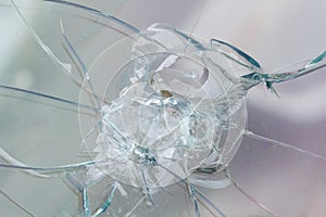 Firearms bullethole on the glass from the bullets, cracks background