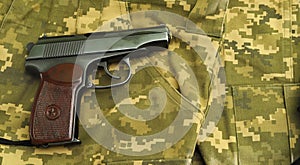 Firearms on military uniform. Top view of a gun with bullets. Military weapons of the USSR.