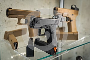 Firearms, pistols on display in a store, close-up photo